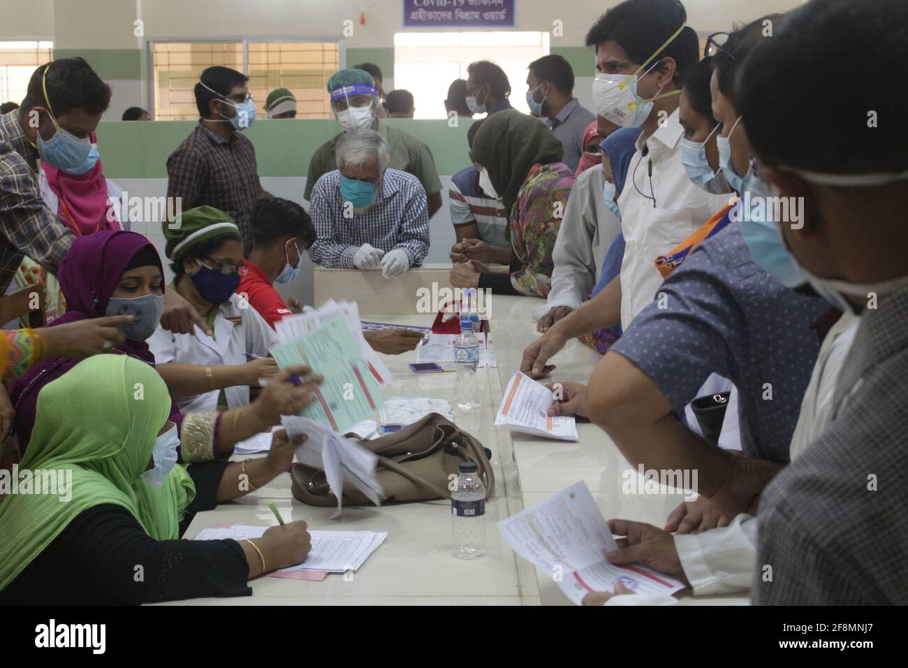 Health workers vaccinate people with the coronavirus vaccination 