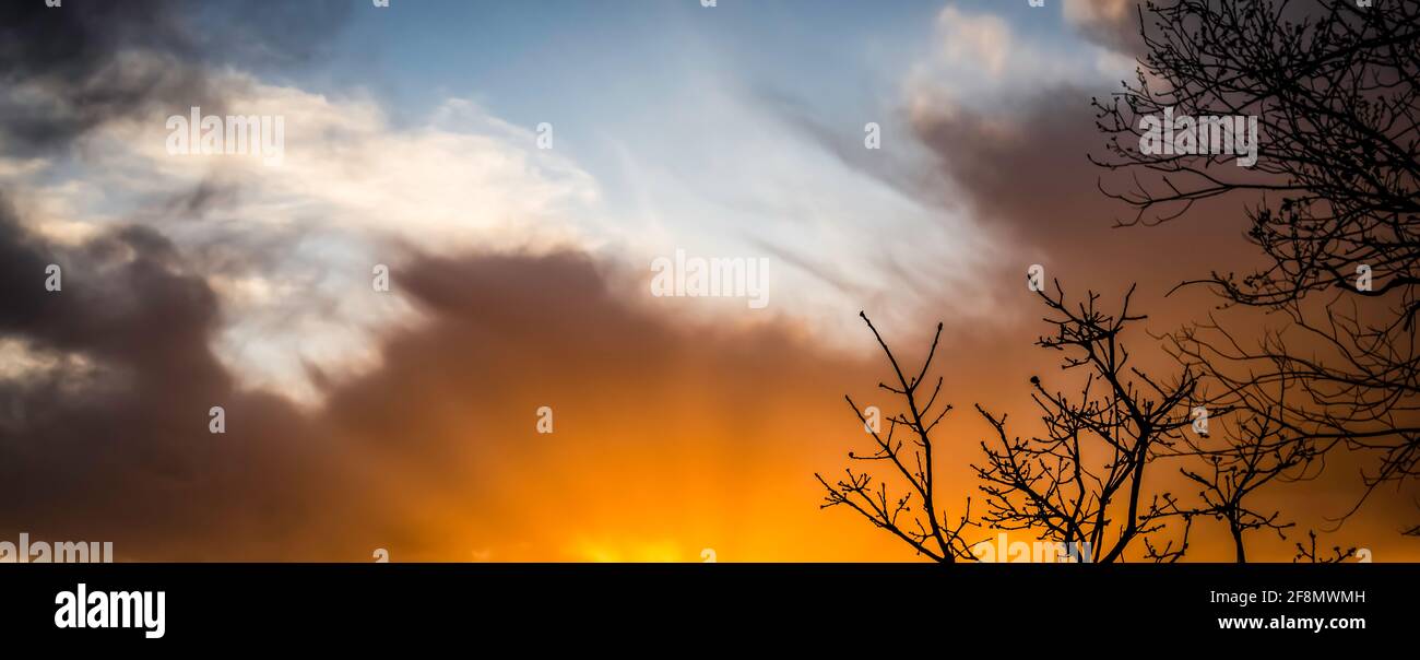An April sunset that is extremely bright and orange. Stock Photo