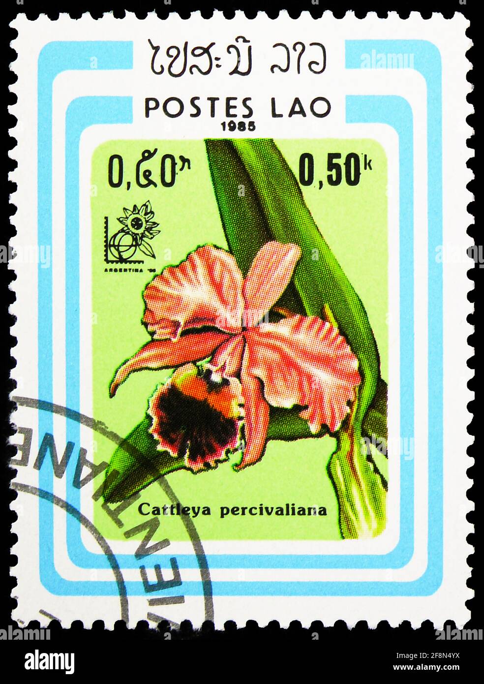 MOSCOW, RUSSIA - SEPTEMBER 30, 2019: Postage stamp printed in Laos shows Cattleya percivaliana, International Stamp Exhibition Argentina 1985 serie, c Stock Photo