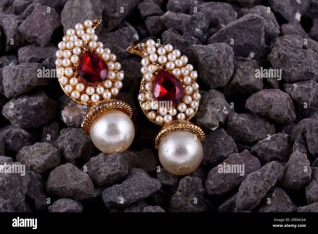 Pearl earrings with ruby gem, Indian traditional jewellery, Indian jewelry Stock Photo