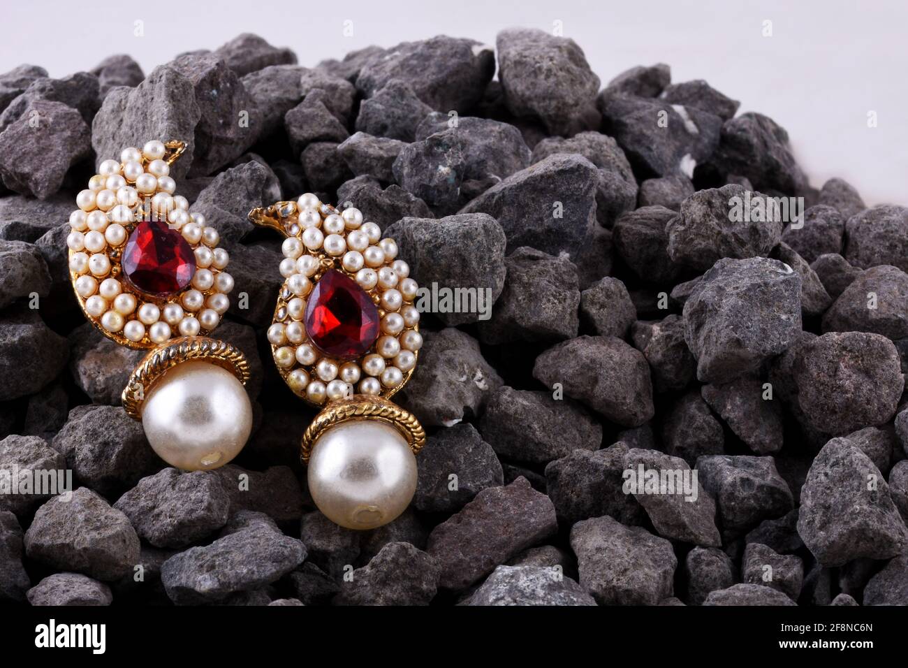 Pearl earrings with ruby gem, Indian traditional jewellery, Indian jewelry Stock Photo