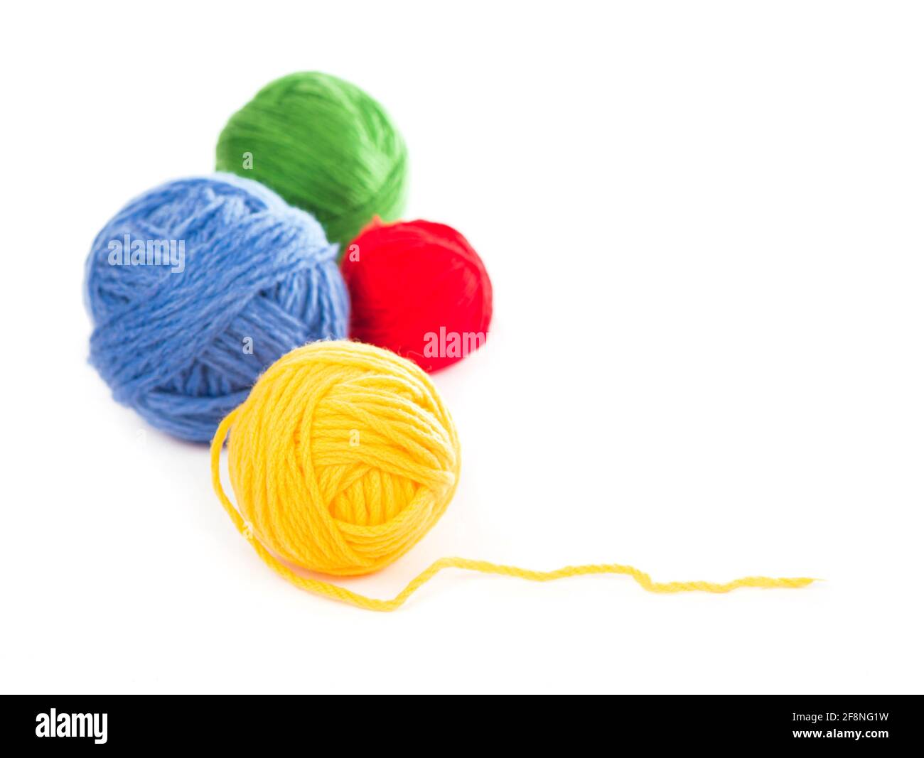 needles for knitting on the white background Stock Photo - Alamy