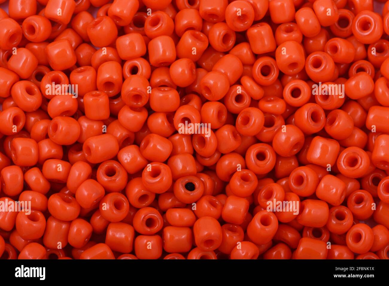 Red Beads on the white background Background Close up, macro, make bead necklace Stock Photo