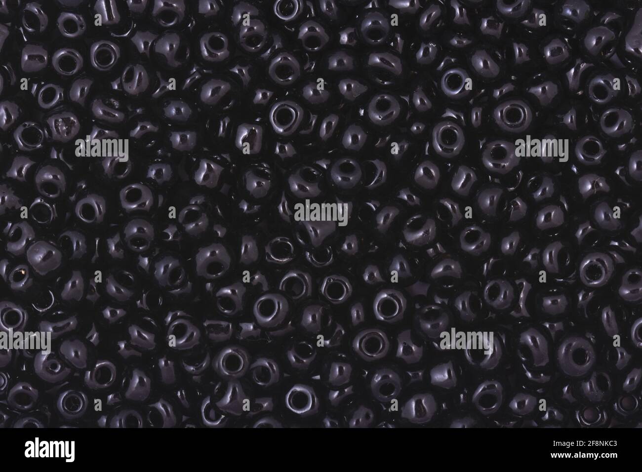 Black Beads on the white background Background Close up, macro, make bead necklace Stock Photo