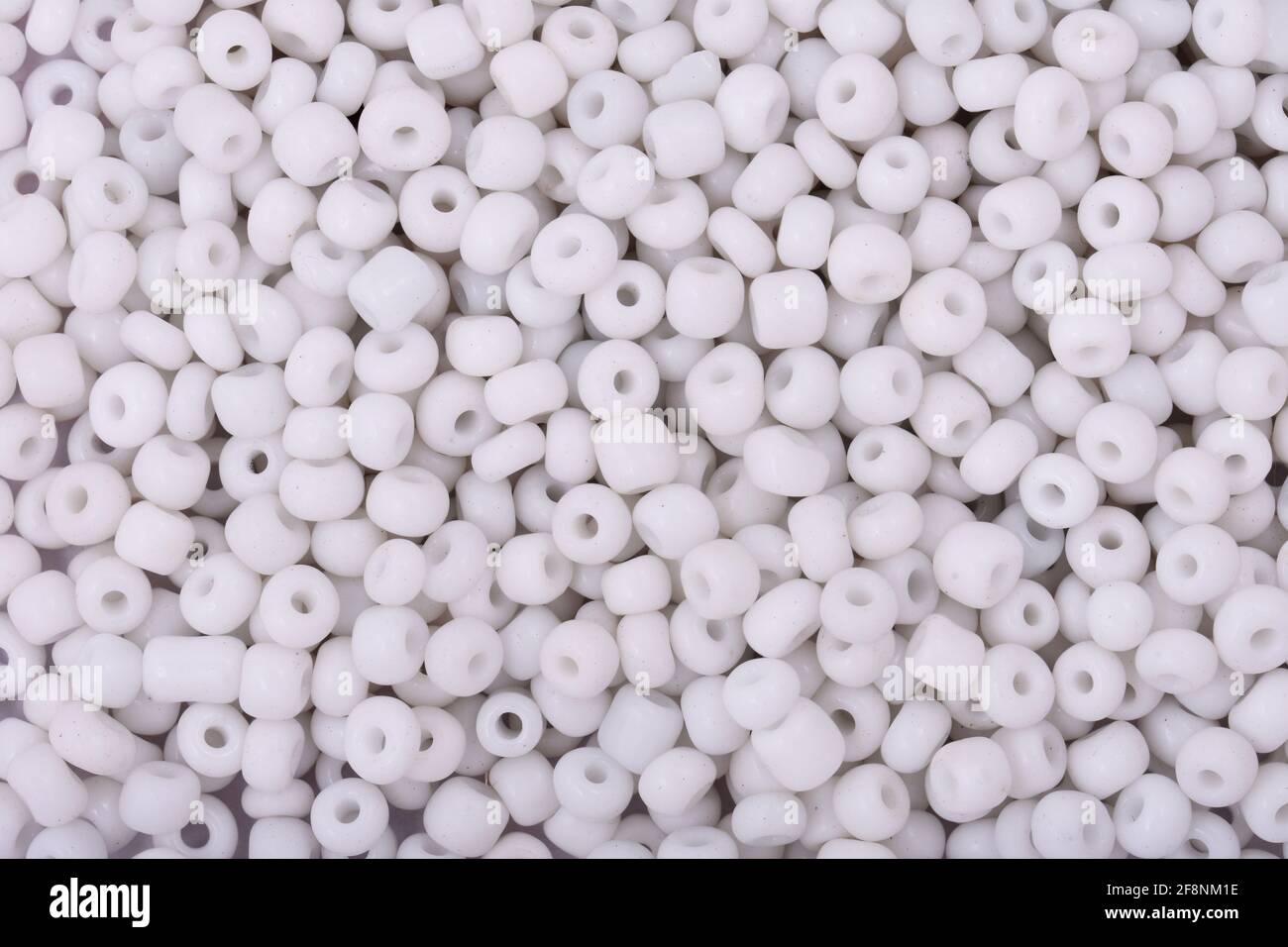 White Beads on the white background Background Close up, macro, make bead necklace Stock Photo