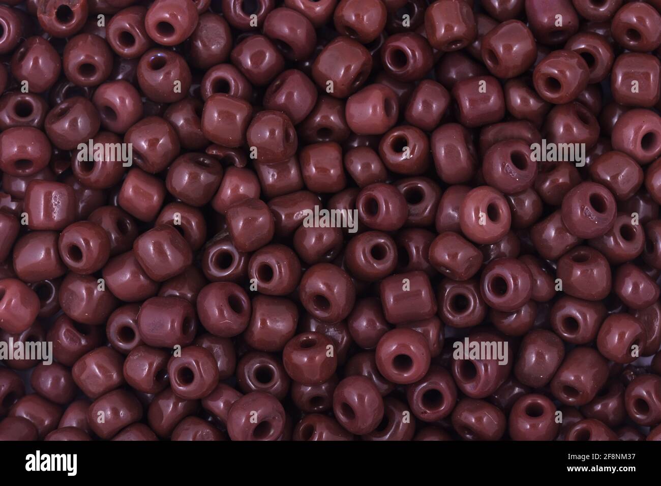 Brown Beads on the white background Background Close up, macro, make bead necklace Stock Photo