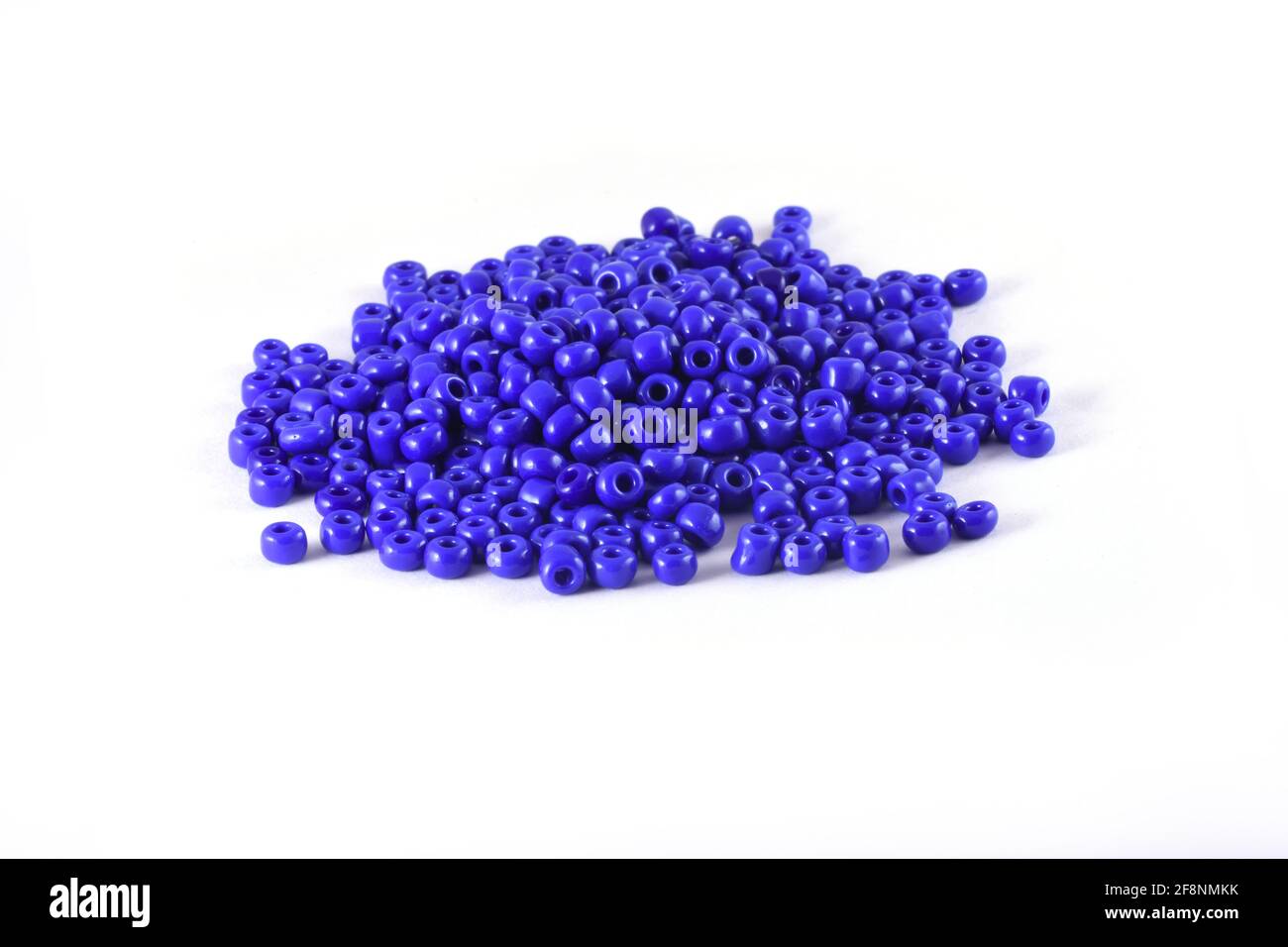 Beads spread on white background Background Close up, macro, make bead necklace or Bead Crochet Daily Beading Stock Photo