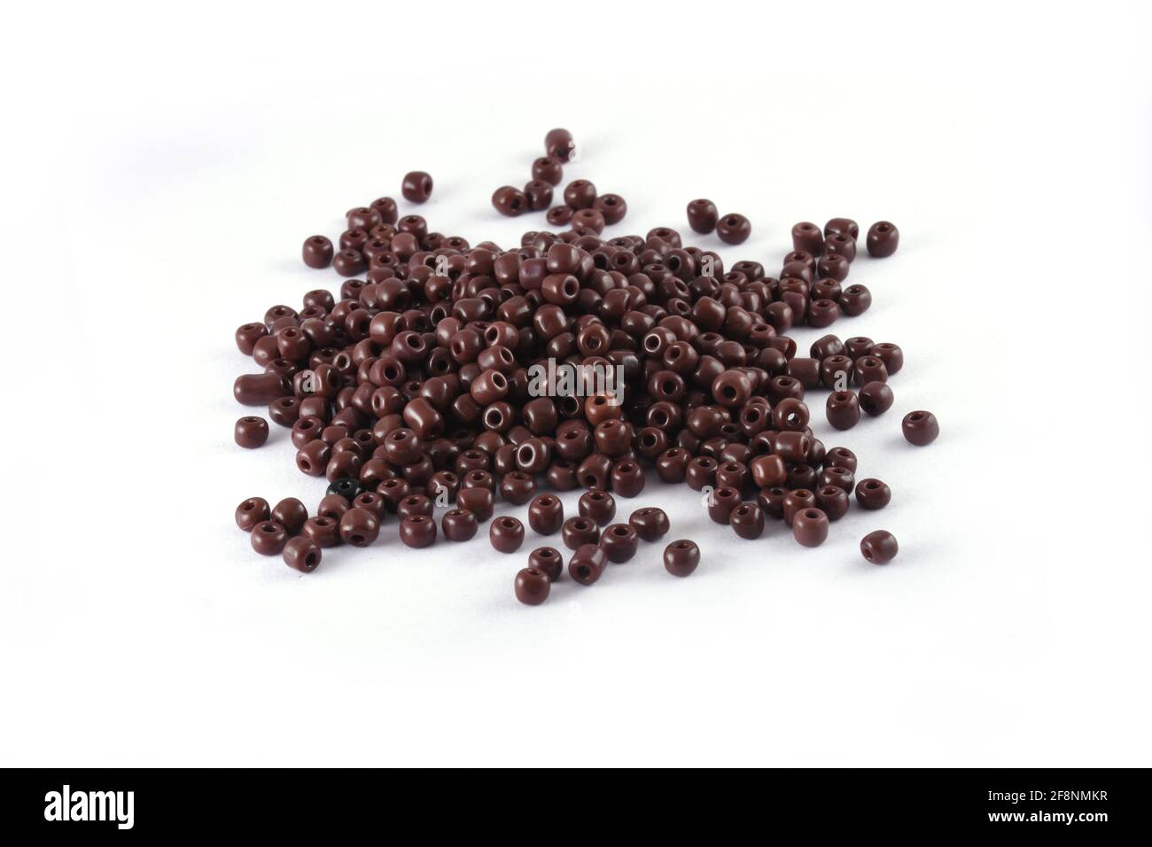 Beads spread on white background Background Close up, macro, make bead necklace or Bead Crochet Daily Beading Stock Photo
