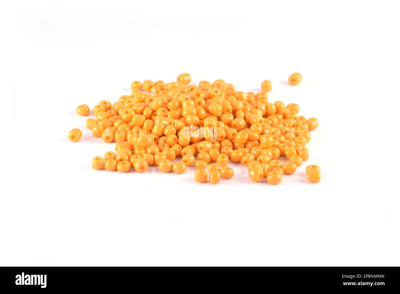Beads spread on white background Background Close up, macro, make bead necklace or Bead Crochet Daily Beading Stock Photo