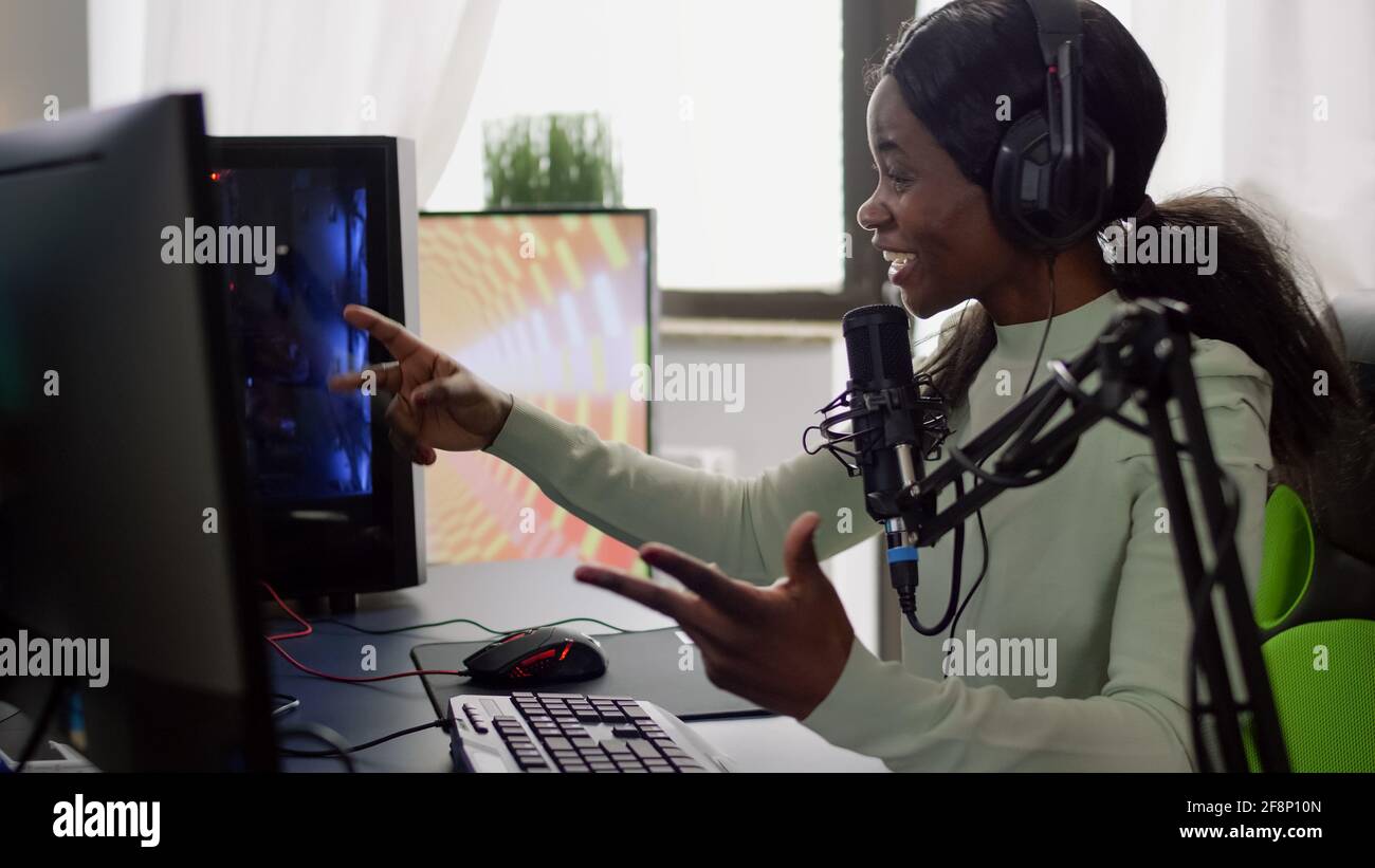 Streamer woman winning space shooter video game during esport ...