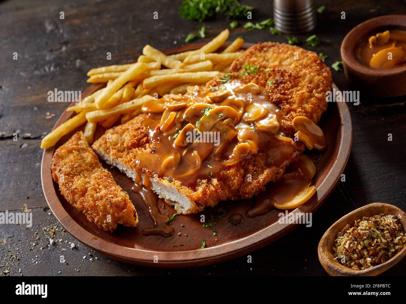 Closeup of yummy fried breaded pork escalope garnished with traditional