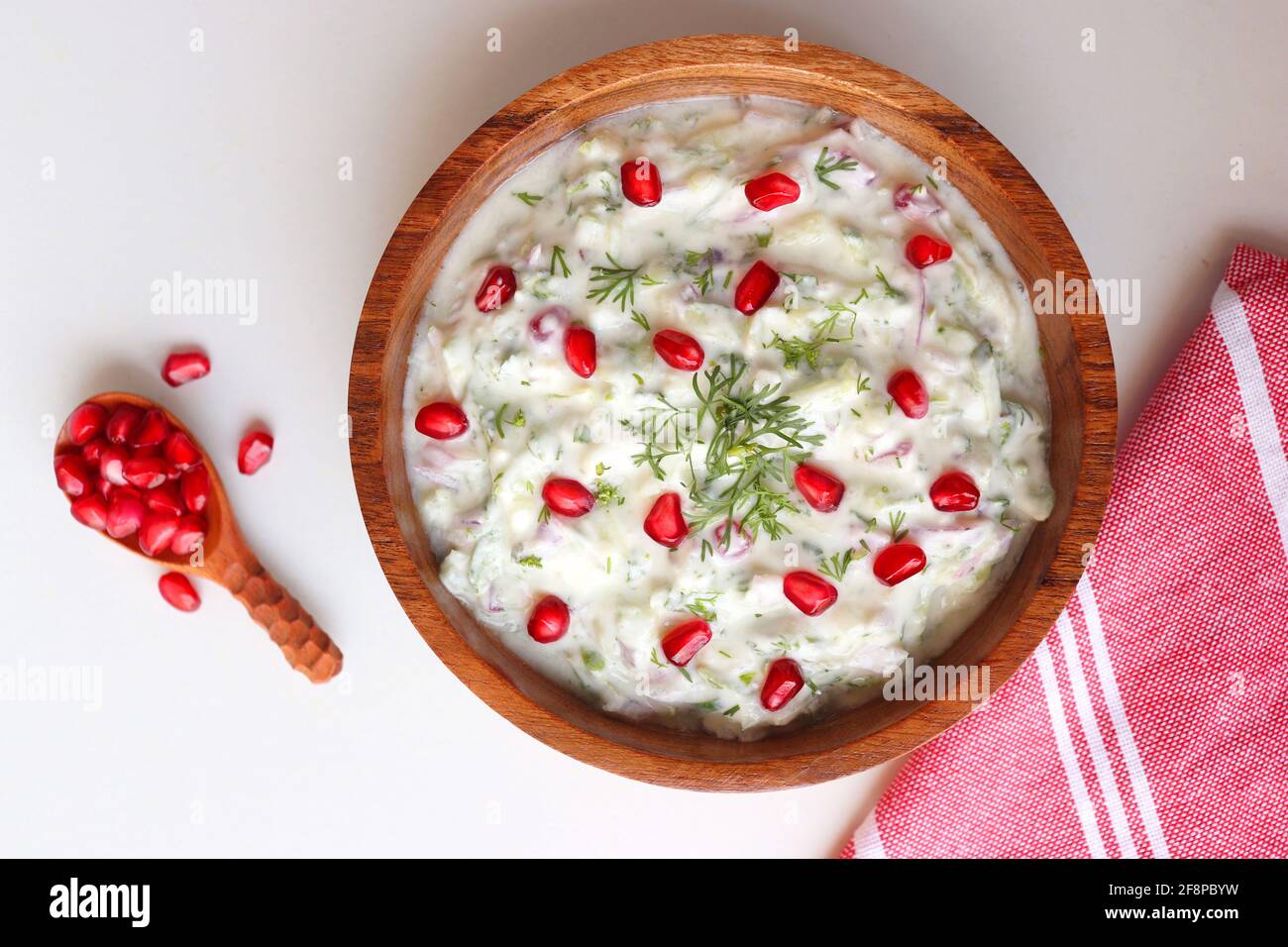 Pomegranate and Cucumber Raita. Indian Fresh sauce or condiment called