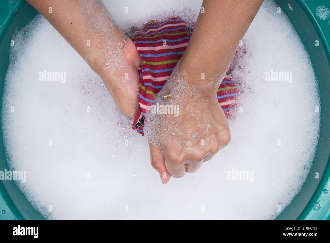 Woman hand wash clothes hi-res stock photography and images - Alamy