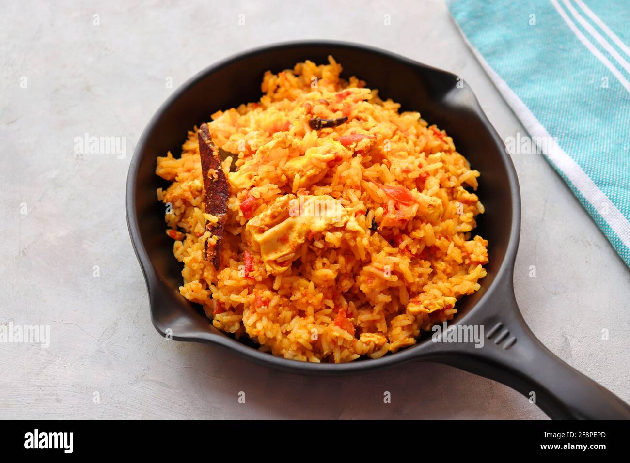 Tomato rice with eggs. Stir fried rice in spicy tomato sauce mixed with