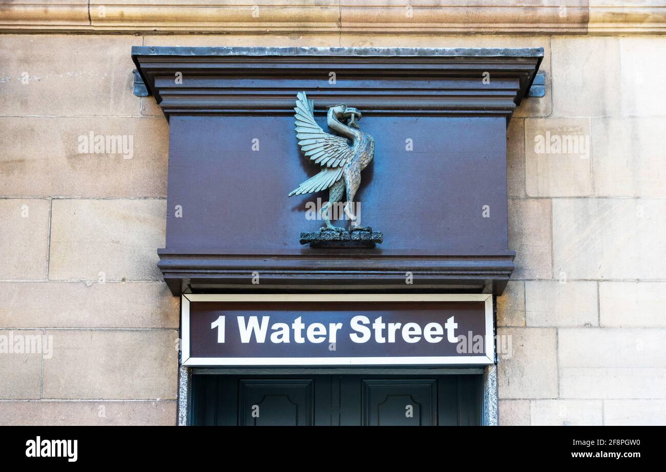 Address sign over the entrance to 1 Water Street in Liverpool city centre displaying a Liver Bird sculpture Stock Photo