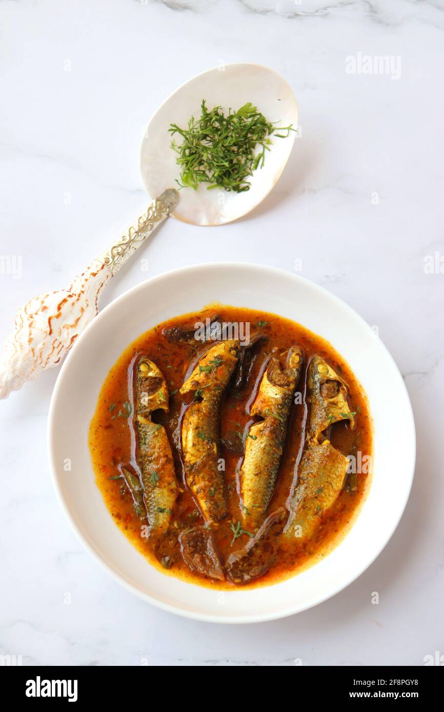 Indian fish curry. White Mullet fish curry made with dried mango and