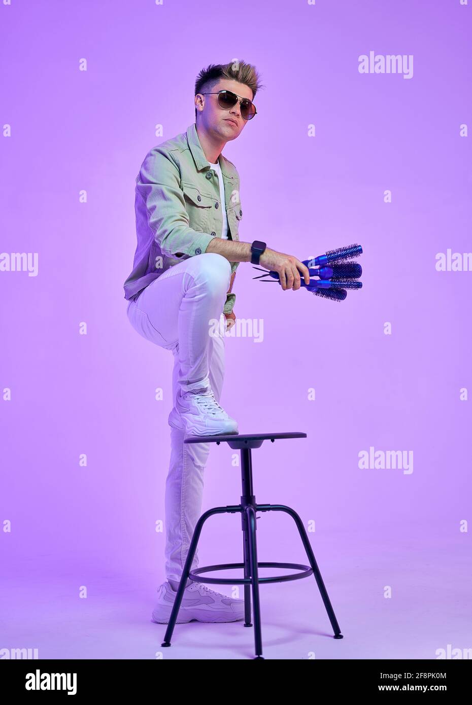 Closeup photo of amazing not smiling macho wearing casual outfit isolated on pink background Stock Photo