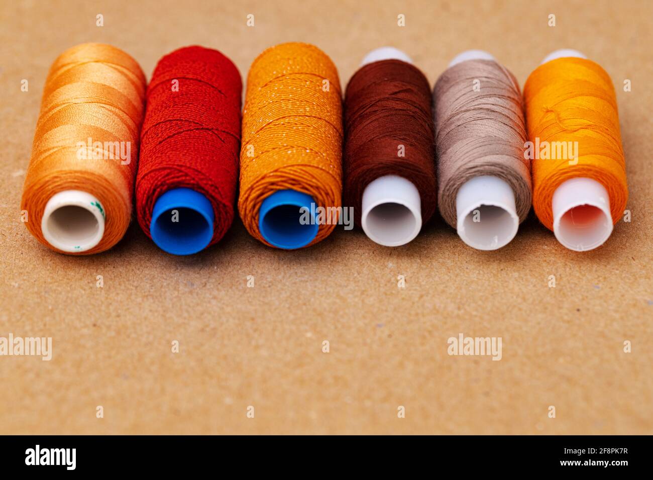 Many colored spools of threads as a background Stock Photo