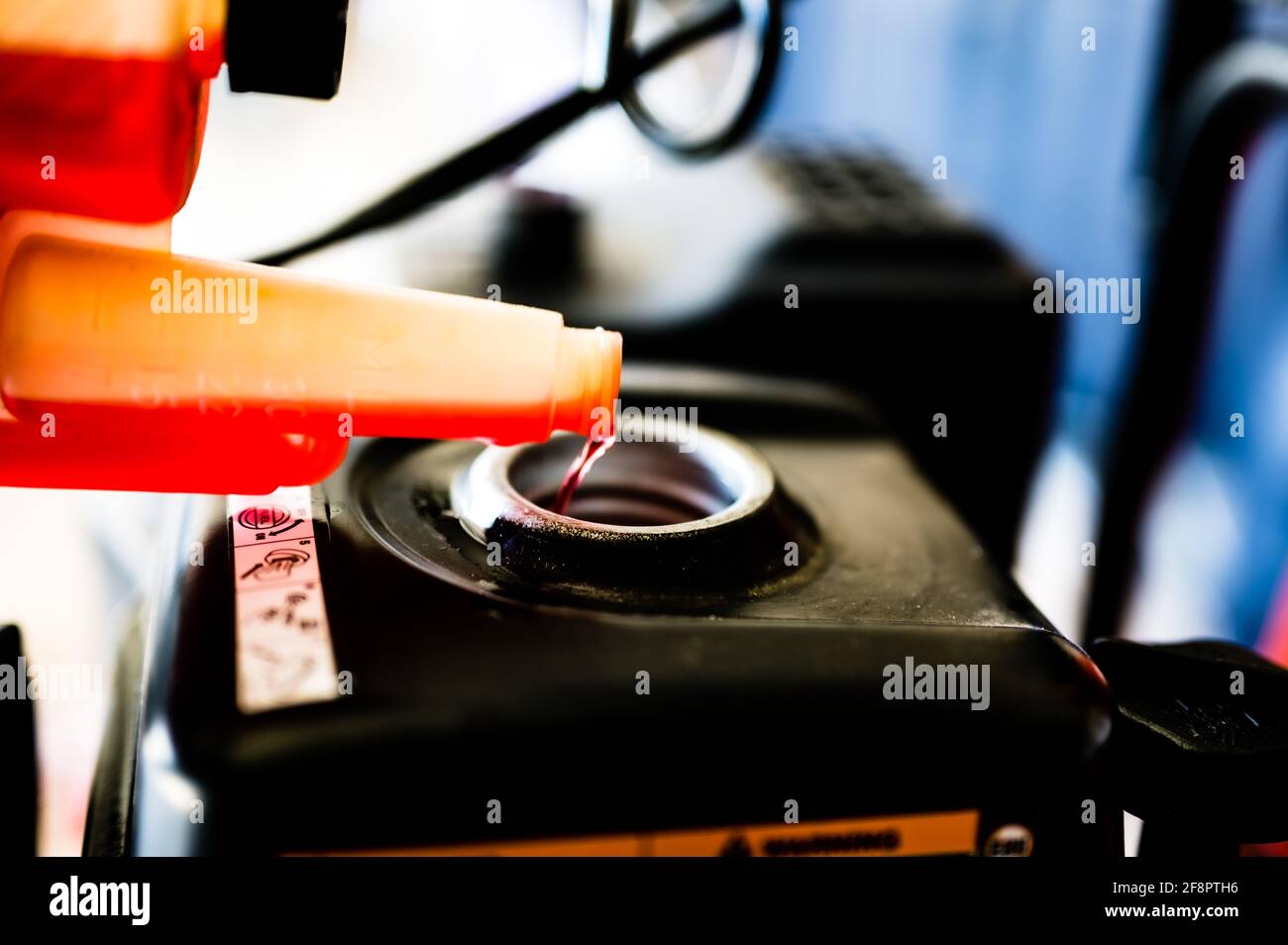 Open gas tank with stabilizer fuel additive being put in before storage Stock Photo Alamy