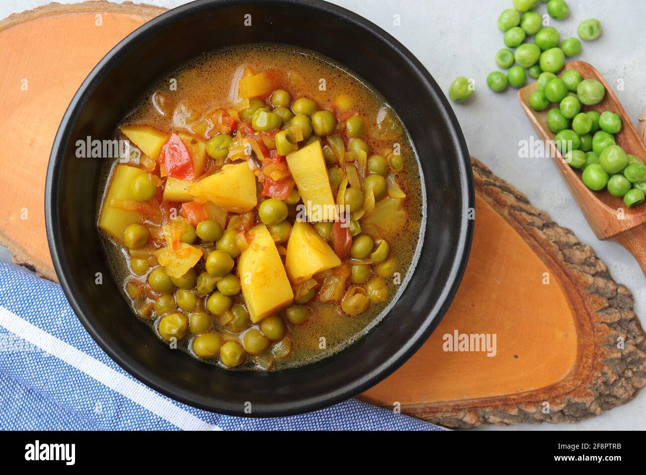 Indian popular homemade Aloo Matar. Potatoes and peas curry. Vatana