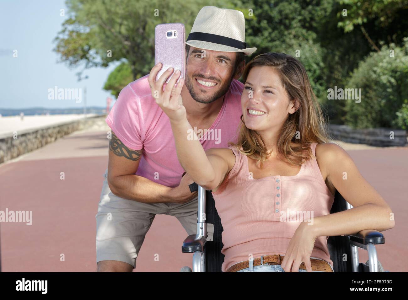 young couple in wheelchair doing a selfie Stock Photo - Alamy