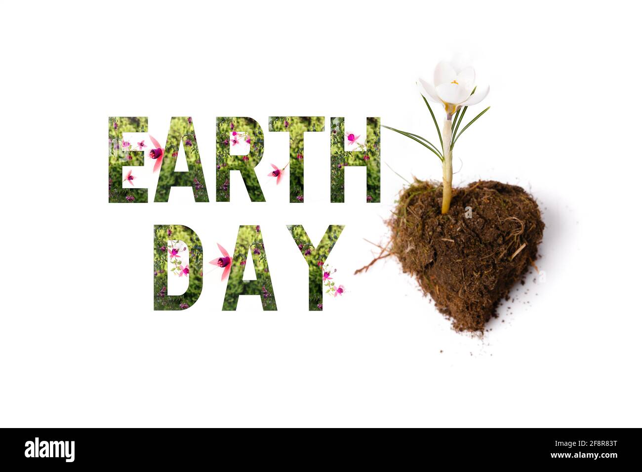 World earth day concept. Lettering Earth day with plants and wonderful flowers Stock Photo