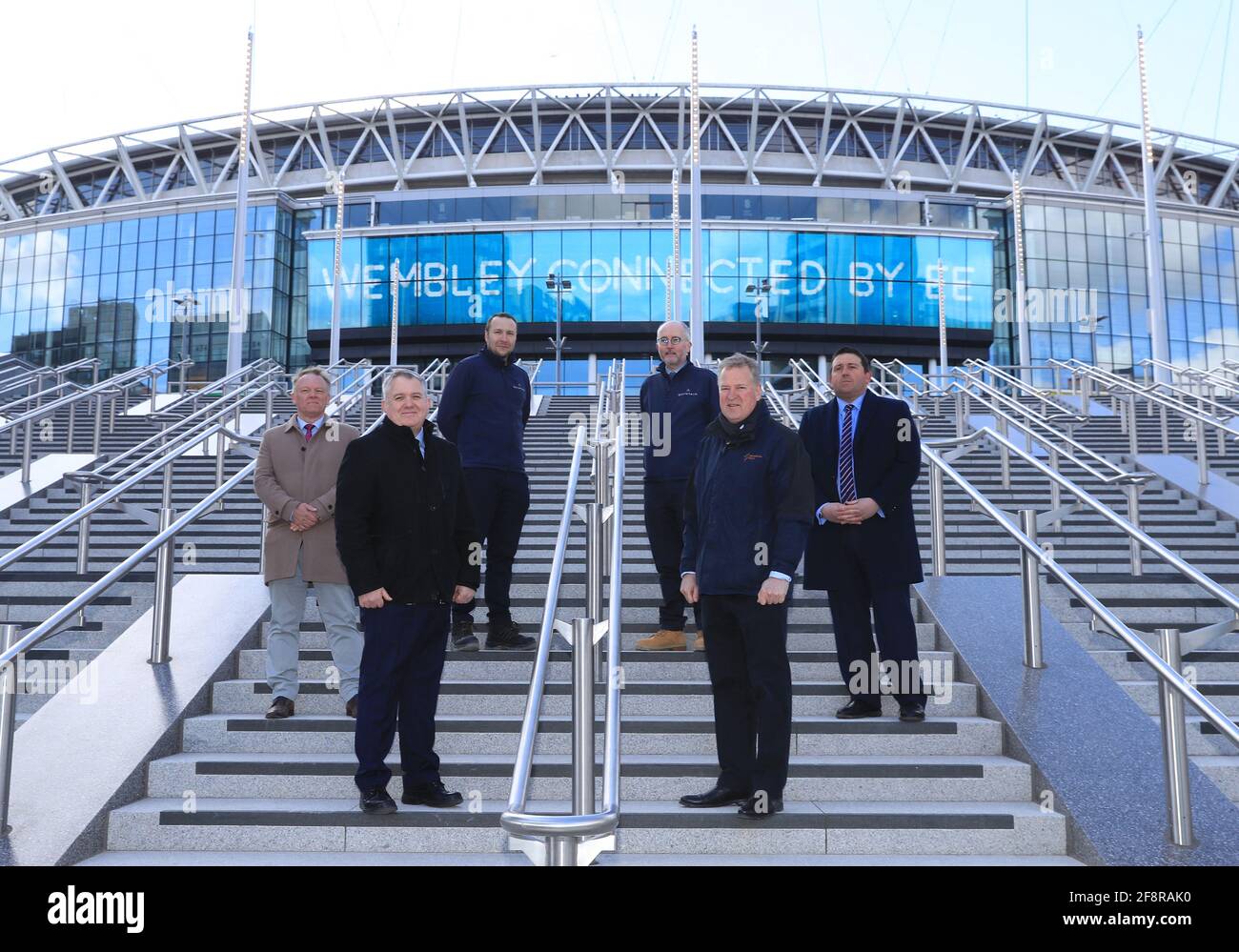 Left to right, Stephen Daniels, Estate Director of Operations, Liam Boylan Stadium Director, Scott Young, Senior Project Manager at Quintain, Julian Tollast, Head of Masterplanning and Design at Quintain, James Saunders CEO of Quintain and Tom Legg, Head of External Operations at The Football Association during the photocall to unveil the Olympic Steps at Wembley Park, London. Picture date: Thursday April 15, 2021. Stock Photo