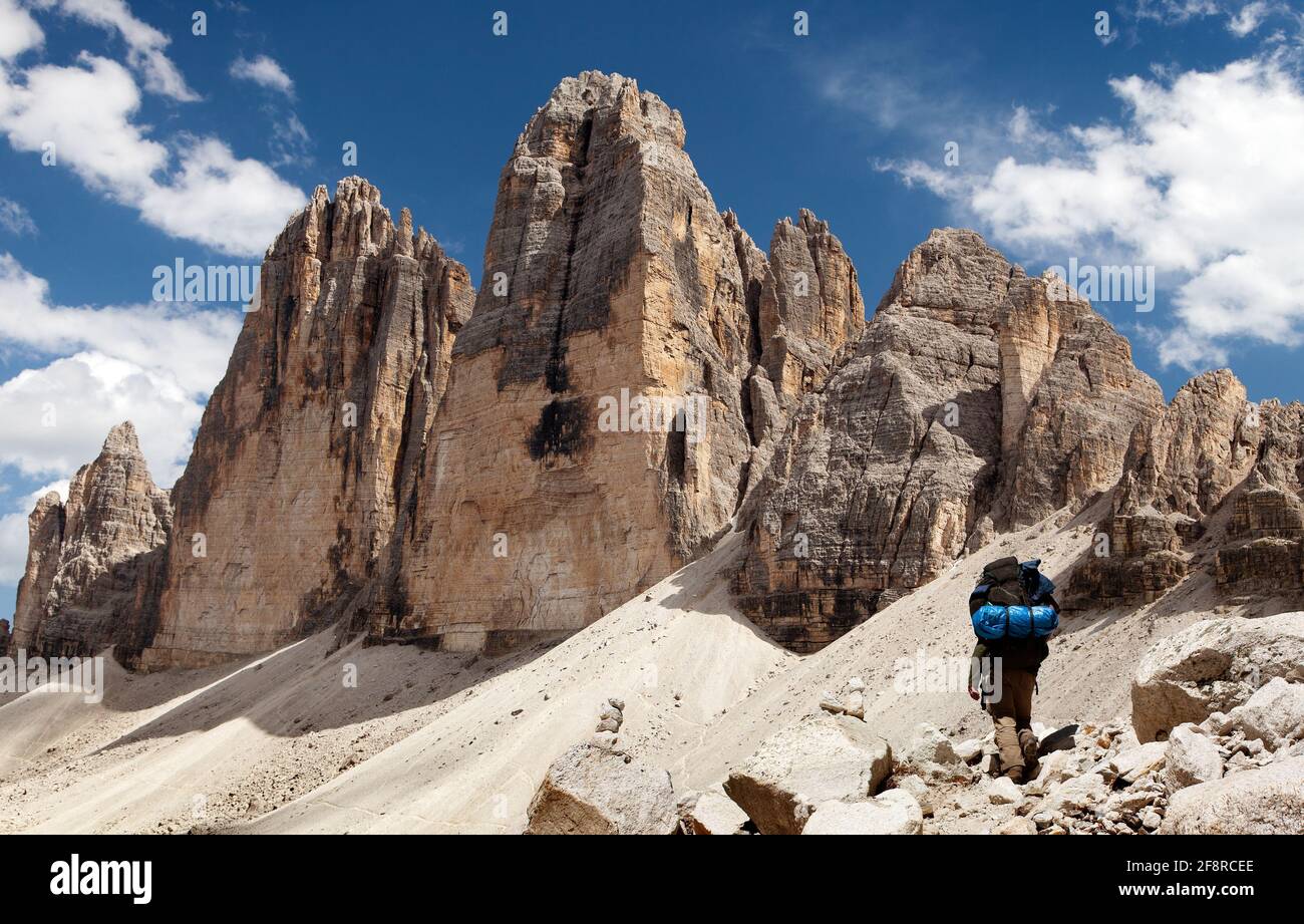 Drei Zinnen or Tre Cime di Lavaredo with hiker, Sextener Dolomiten or Dolomiti di Sesto, South Tirol, Dolomiten mountains view, Italien Alps Stock Photo