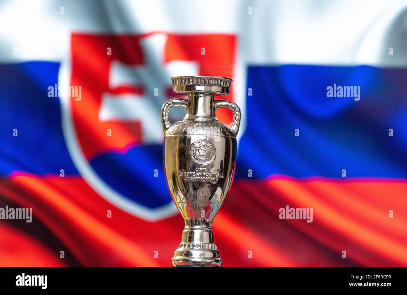 April 10, 2021. Bratislava, Slovakia. UEFA European Championship Cup with the Slovakian flag in the background. Stock Photo