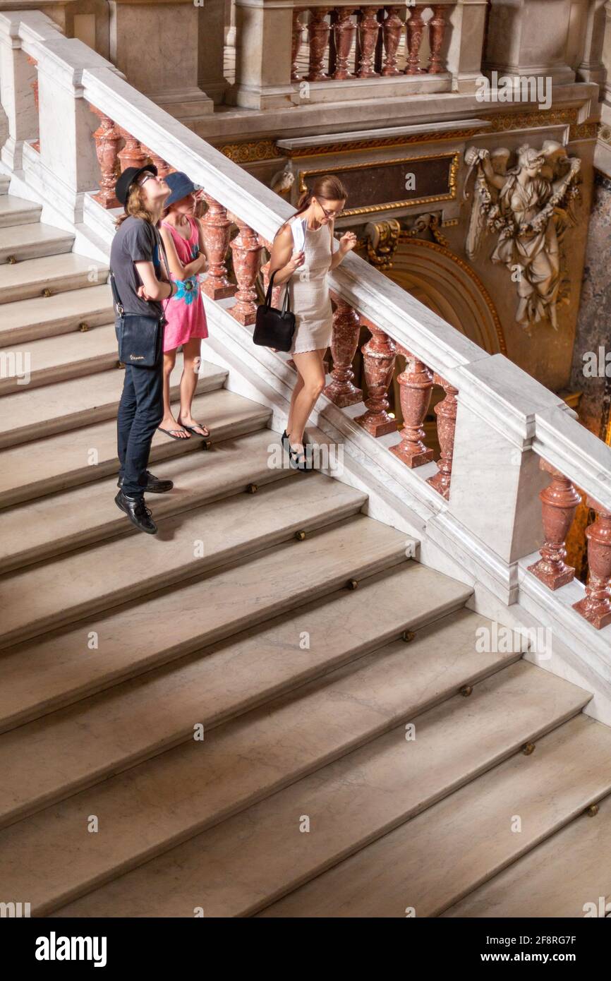 Mother and Children Descend Stairs in Vienna Museum, Austria Stock Photo