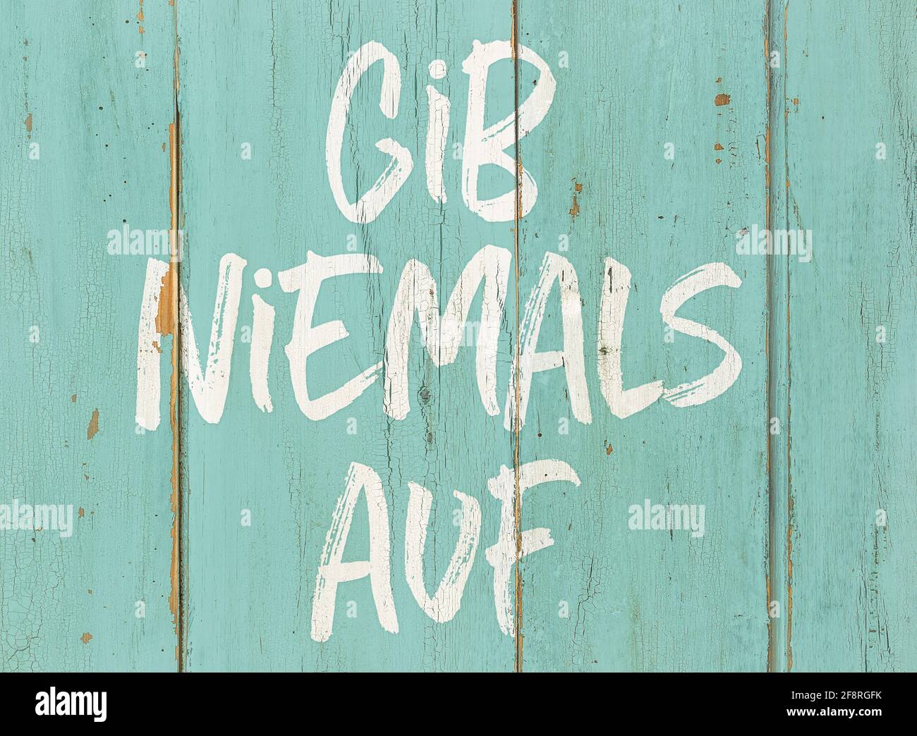 Motivational quote Never give up in german Gib niemals auf Stock