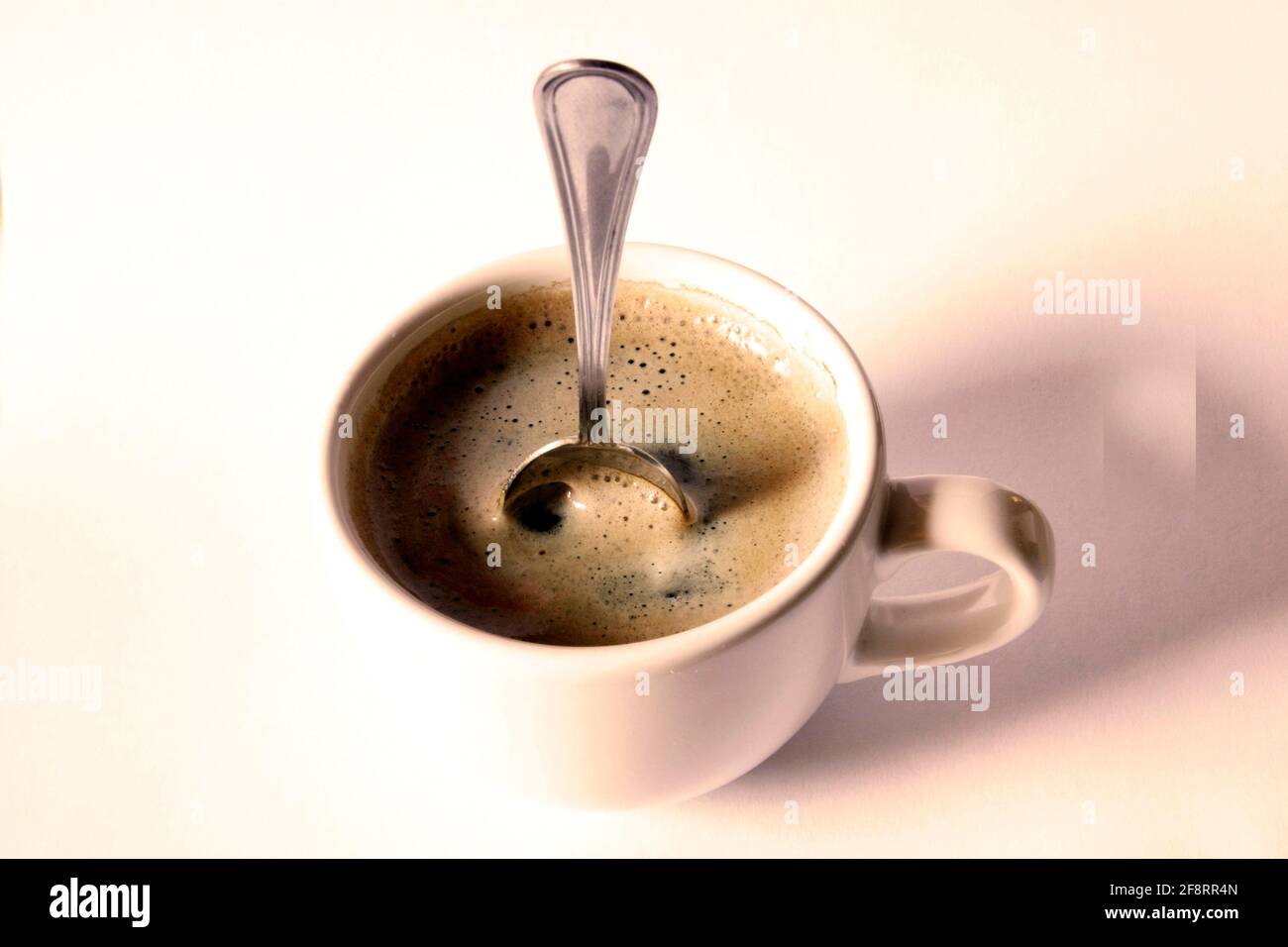 strong coffee, coffee spoon standing in the coffee Stock Photo