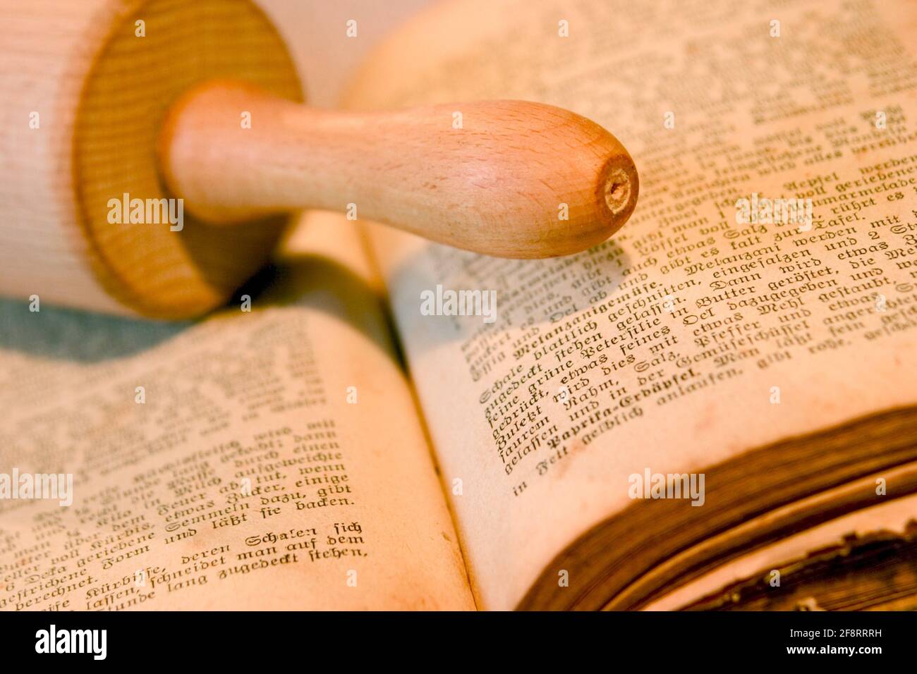 old cookbook with rolling pin Stock Photo