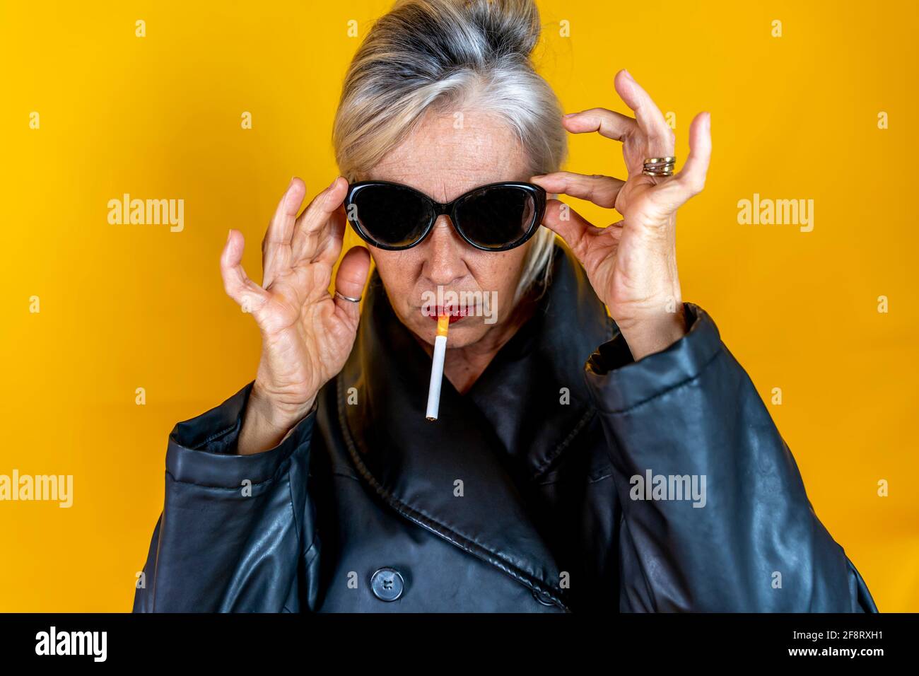 Old woman smoking party hires stock photography and images Alamy
