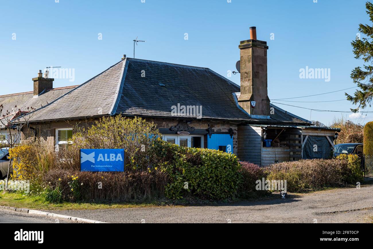 East Lothian, Scotland, United Kingdom, 15th April 2021. ALBA support: one resident of the county looks likely to vote for the new Alba party and Scottish independence at the forthcoming Scottish parliamentary election on May 6th with a large political party banner outside the cottage at the roadside Stock Photo