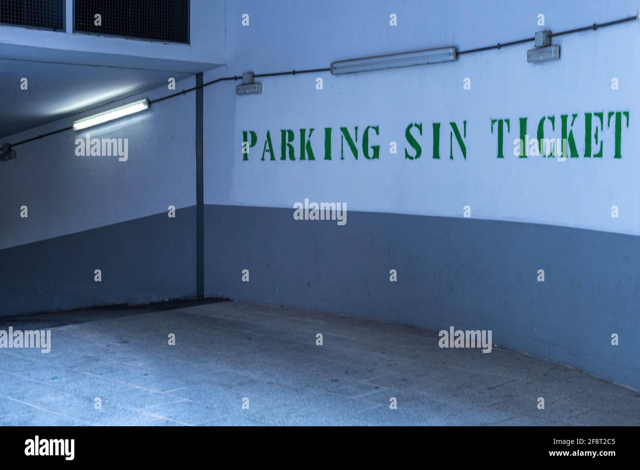 Entrance to the parking lot of a city car garage with a sign on the
