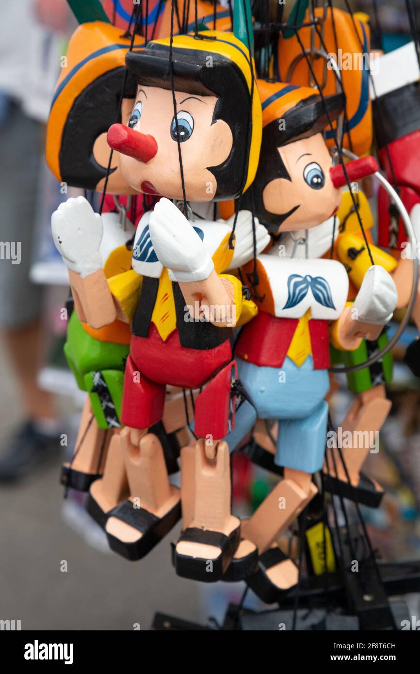 Souvenir Pinocchio puppets in a Street Market in Florence, italy Stock Photo