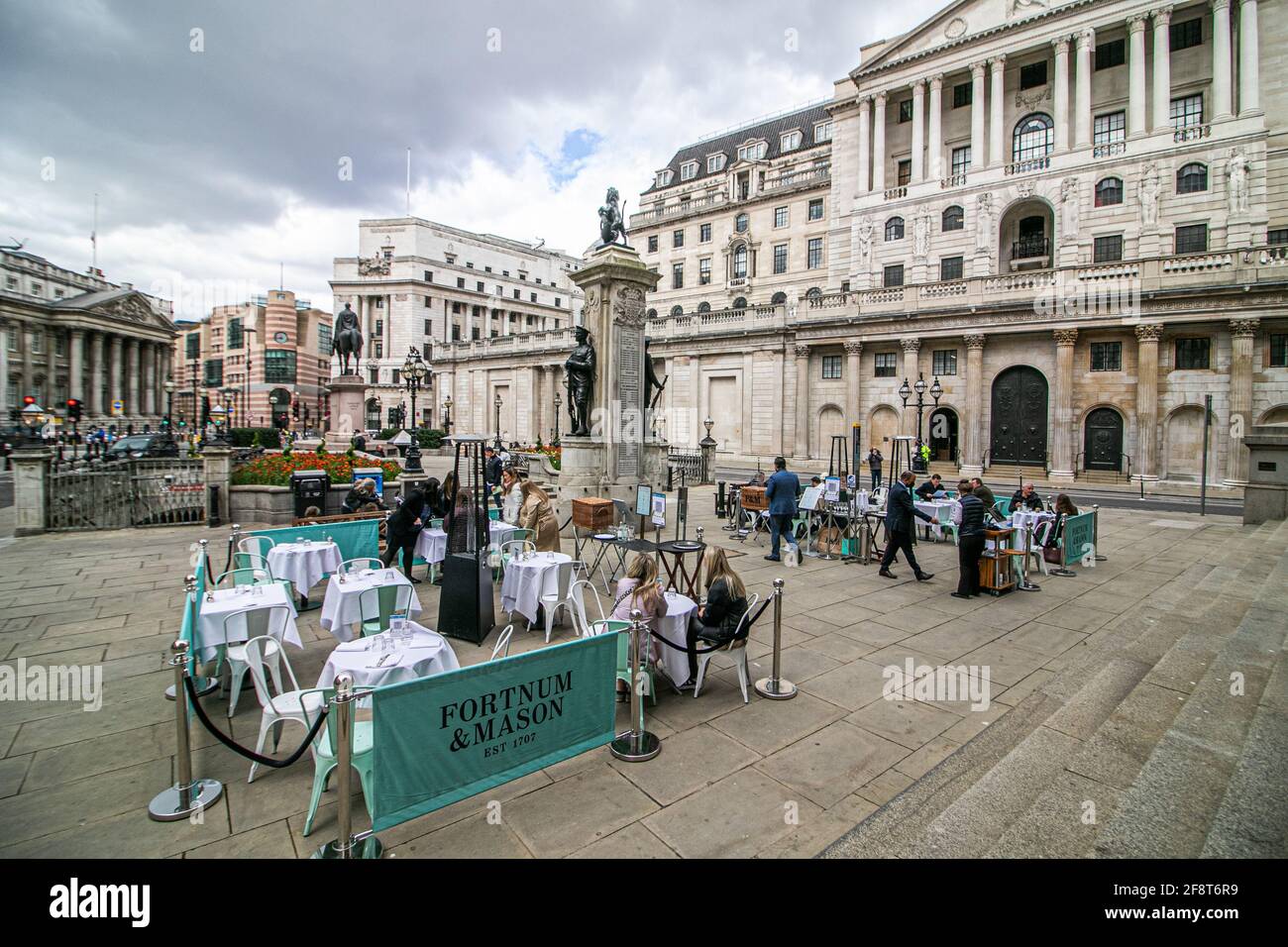 BANK LONDON, UK. 15th Apr, 2021. People are being served food and drink at Fortnum and Mason in Bank financial district offering al fresco dining following the UK government's easing of lockdown restrictions which allowed non-essential businesses to reopen since Monday 12 April. Credit: amer ghazzal/Alamy Live News Stock Photo
