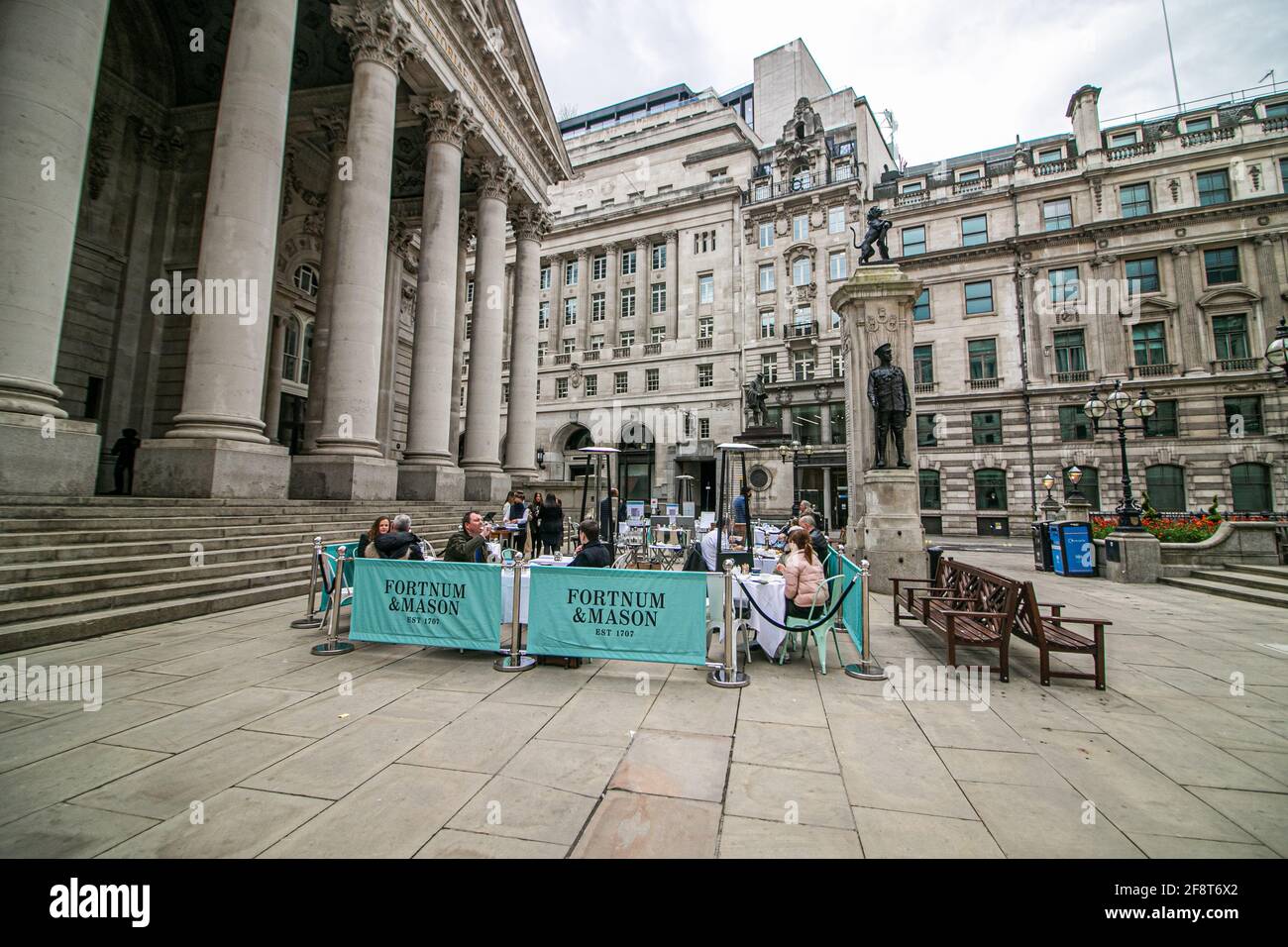 BANK LONDON, UK. 15th Apr, 2021. People are being served food and drink at Fortnum and Mason in Bank financial district offering al fresco dining following the UK government's easing of lockdown restrictions which allowed non-essential businesses to reopen since Monday 12 April. Credit: amer ghazzal/Alamy Live News Stock Photo