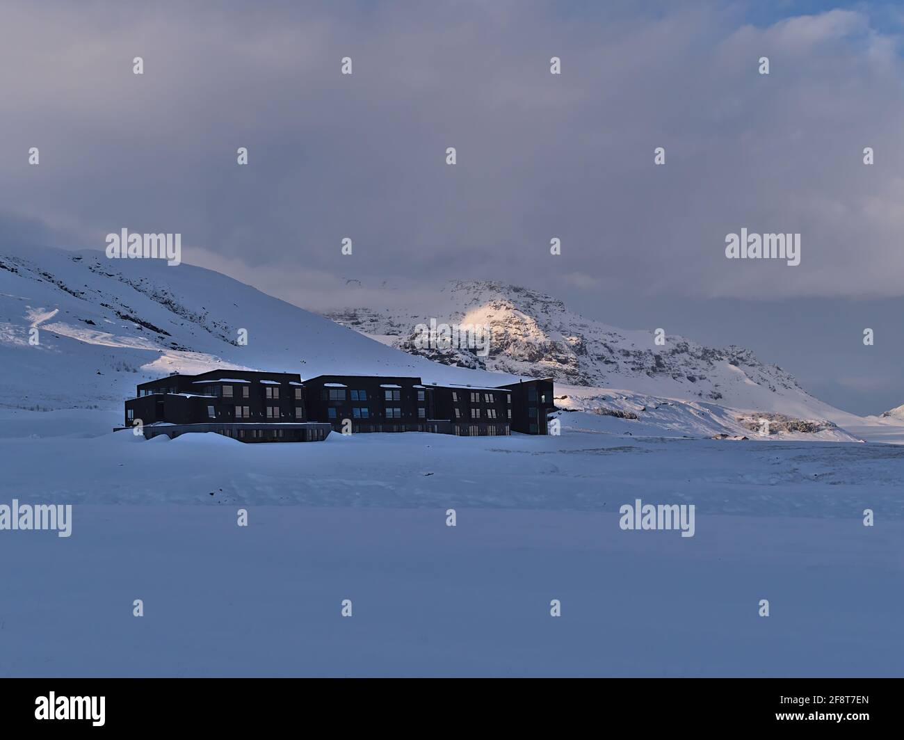View of tourist accommodation Fosshotel Glacier Lagoon, operated by company Islandshotel, largest Icelandic hotel chain, in winter. Stock Photo