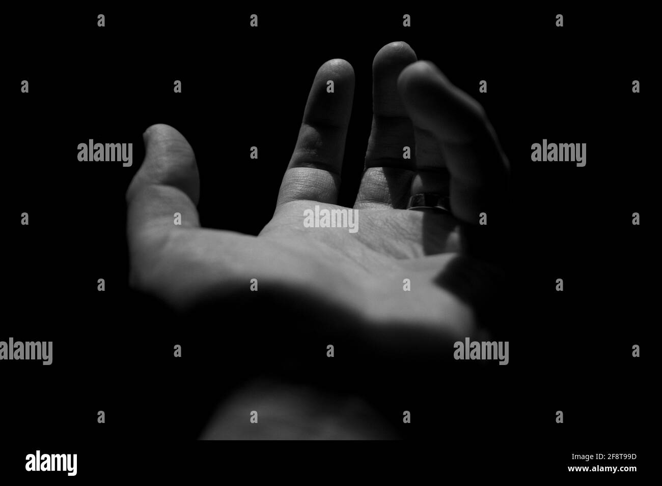 Reaching out hand in Black & White Stock Photo