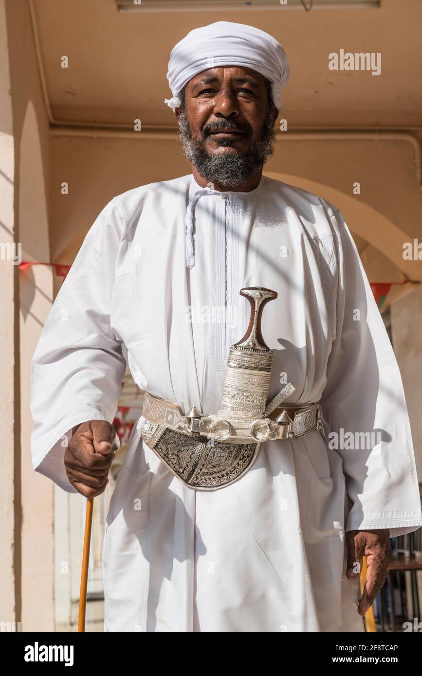 Senior Omani man wearing the traditional khanjar in the town Ibra, Oman