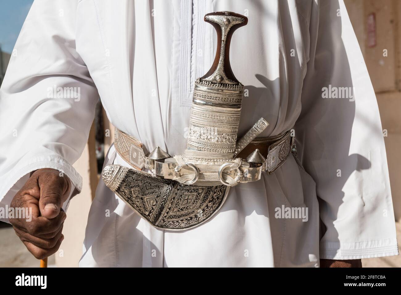 Senior Omani man wearing the traditional khanjar in the town Ibra, Oman