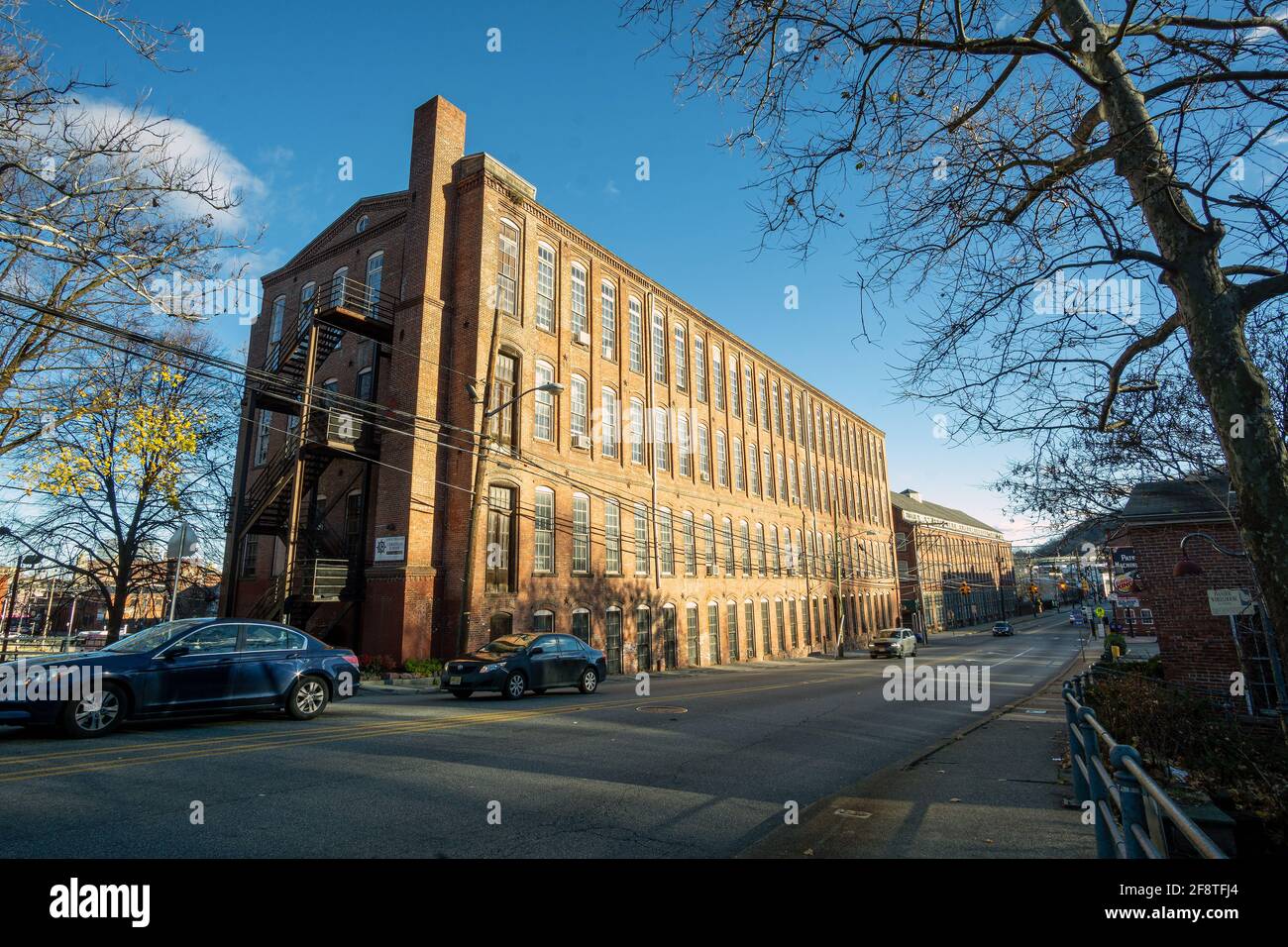 Paterson, NJ - USA - Dec. 6, 2020: Landscape view old red brick factory buildings that made up Paterson, NJ near the great falls. Stock Photo