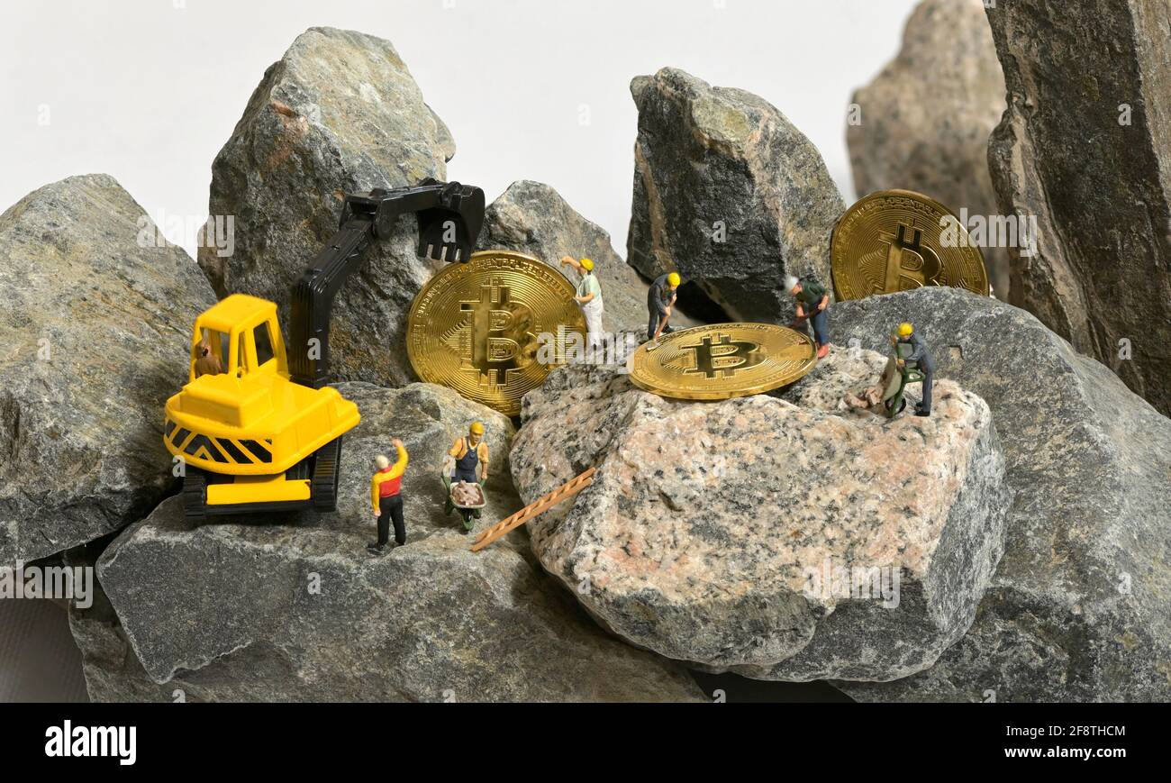 Galati, Romania - April 13, 2021 Construction site with miniature workers cryptocurrency  mining Bitcoin Stock Photo - Alamy