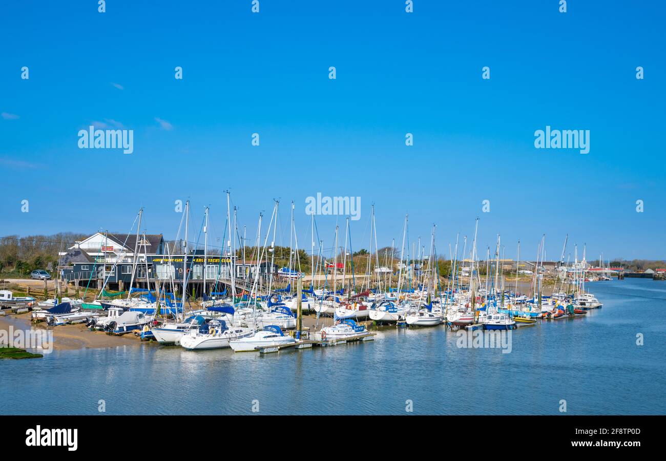 Docked or moored yachts, sailing boats and other boats on pontoons at the Arun Yacht Club on the River Arun in Littlehampton, West Sussex, England, UK Stock Photo