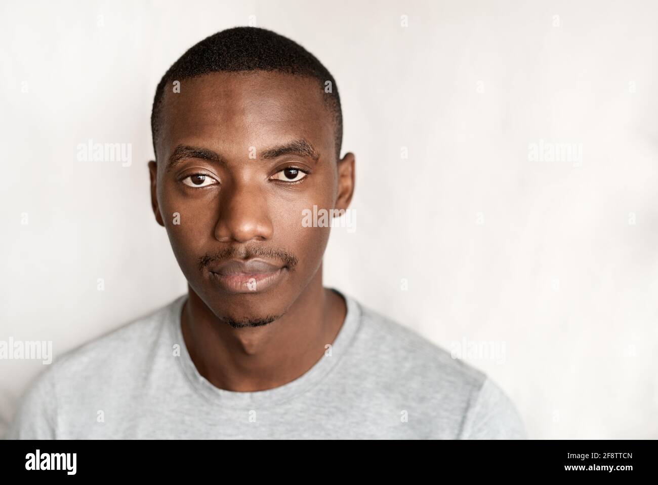 Confident young African man wearing a t-shirt Stock Photo