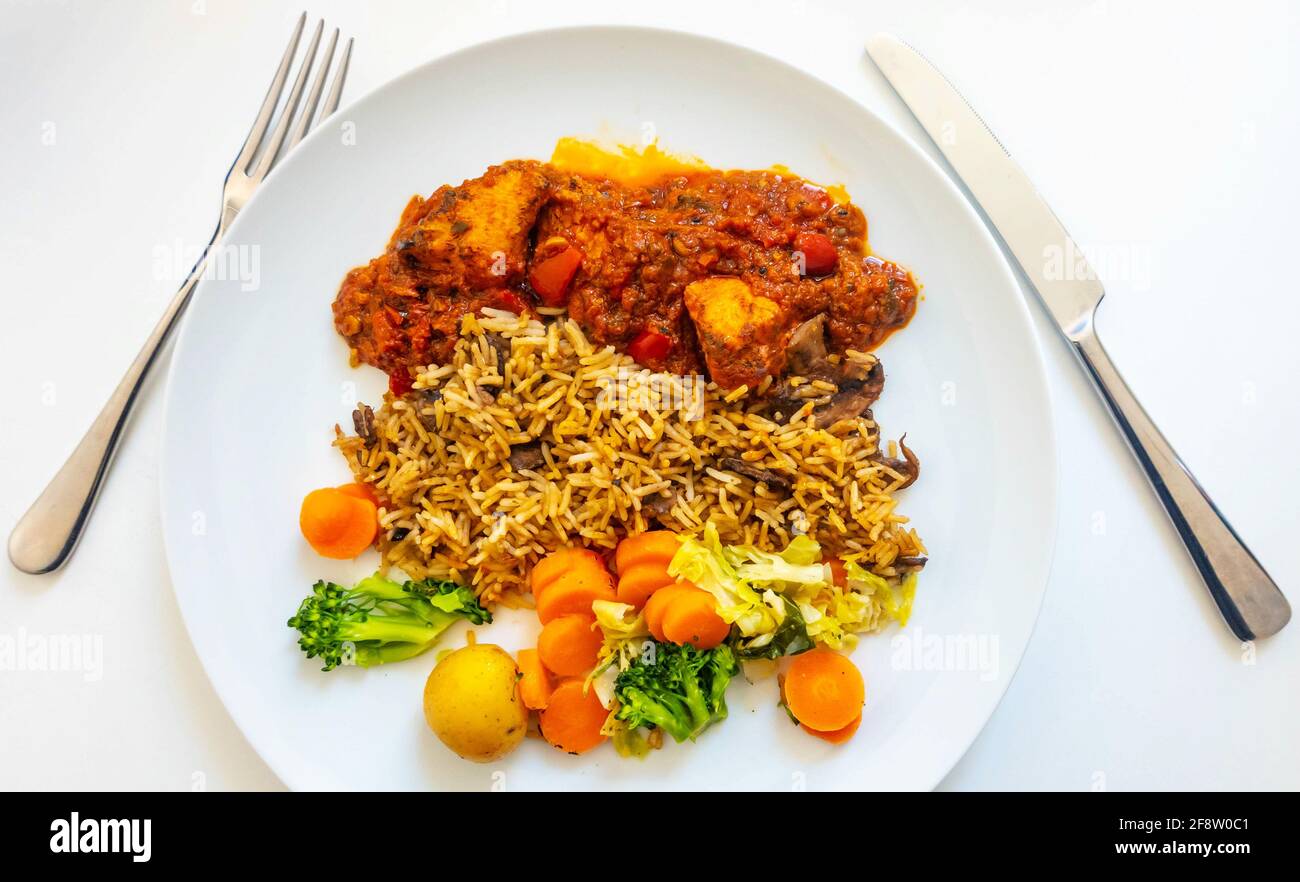 Chicken curry, mushroom rice, and mixed vegetables Stock Photo Alamy