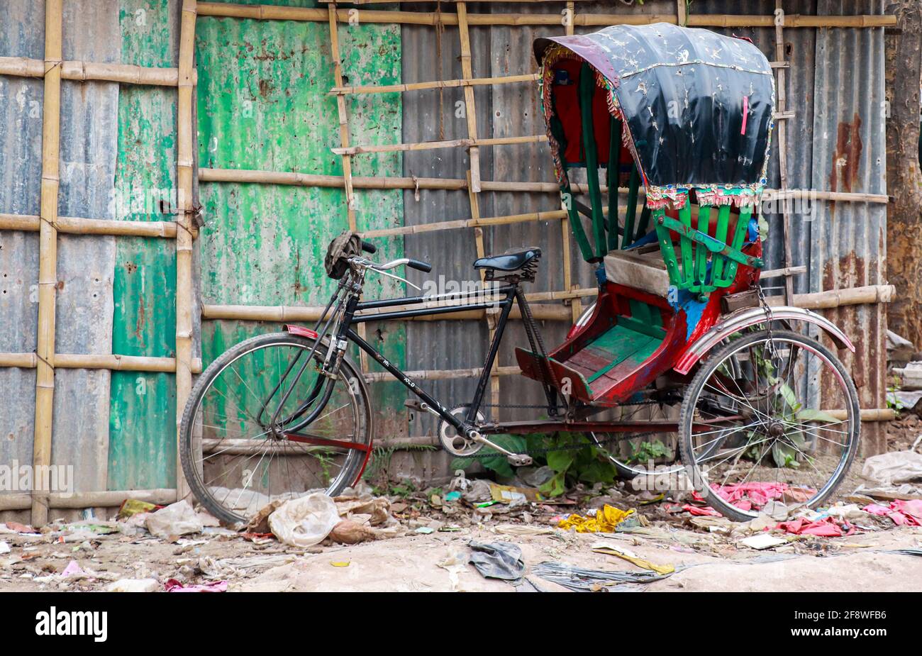 A rickshaw parked near road . Stock Photo