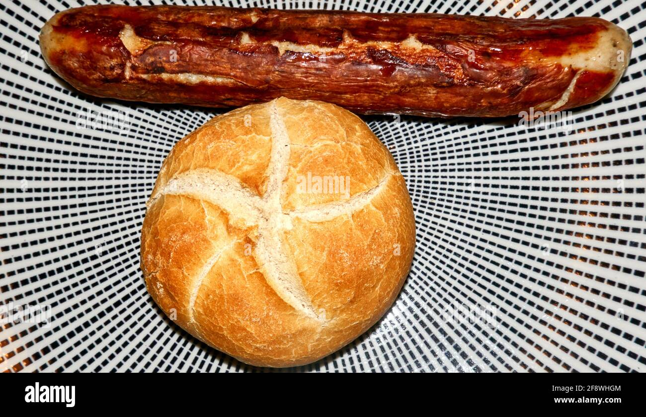 Bratwurst and rolls on a plate made of porcelain, typical traditional German food Stock Photo
